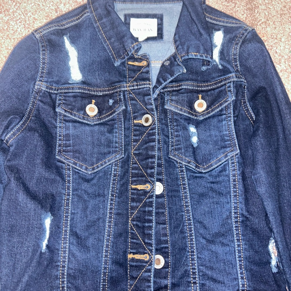 Distressed jean jacket. never worn. great condition.